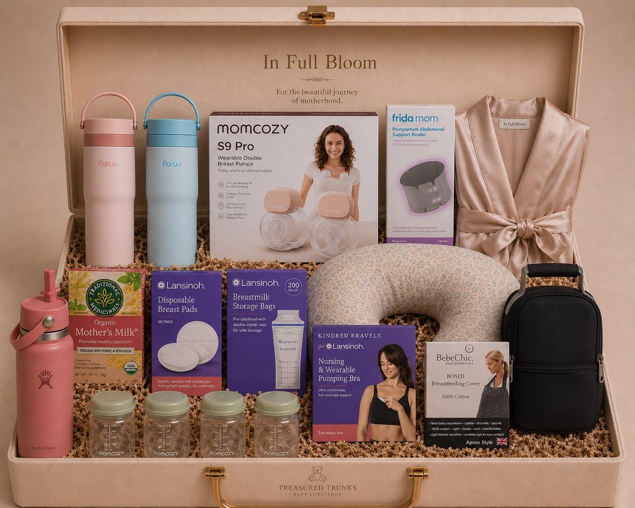 A satin robe, feeding pillow and postpartum essentials in the In Full Bloom trunk