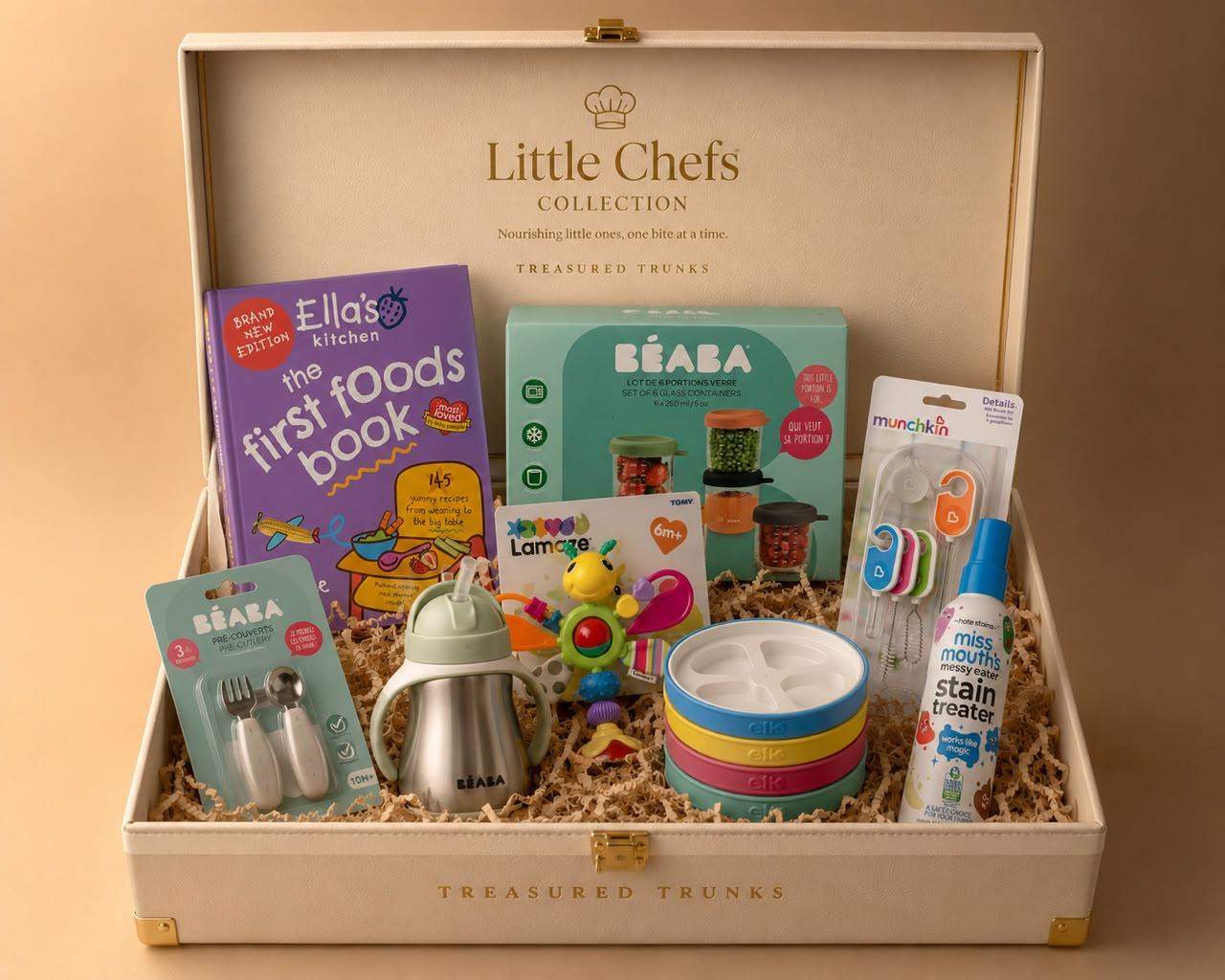 A compact Little Chefs trunk presented with cutlery, bowls and a first foods cookbook